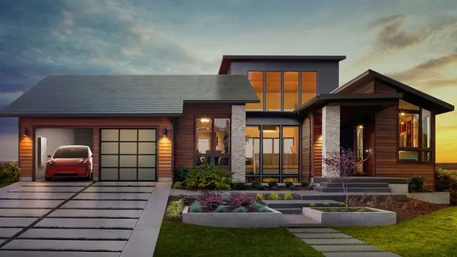 Tesla Solar Roof installed on a modern home with an electric car